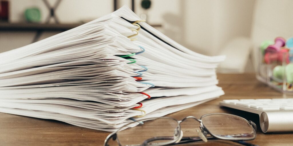 Stack of papers with colour paper clips