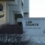 Photo of Law Courts sign outside of Edmonton's court house