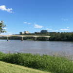 Edmonton's North Saskatchewan River with a bridge and blue sky