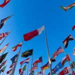 Low Angle Shot of Flags on the Background of a Clear Blue Sky