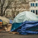 Encampment for unhoused individuals in the middle of high rises