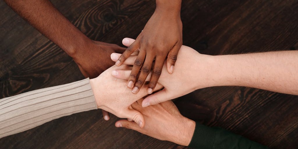 group of people with their hands together