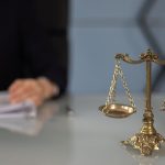 A balance scale on a woman's table